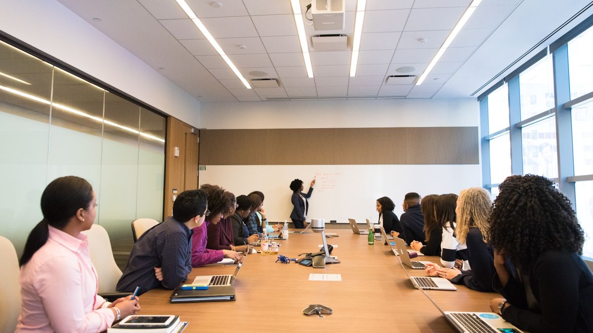 Conference room with professionals reviewing documents